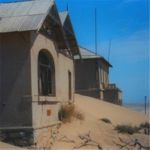 House buried in sand