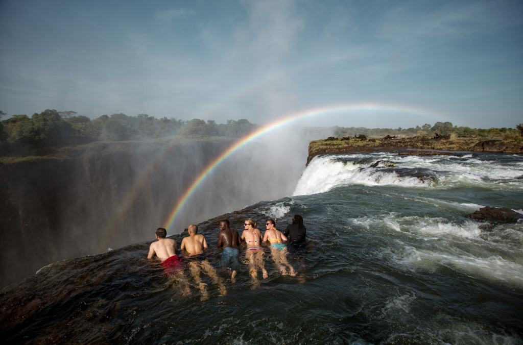 Looking over the edge of the Devil's Pool (Zambia Tourism)