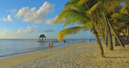 Couple walking along the beach at Mauritius