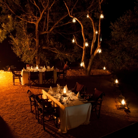 Bush dining by lantern light