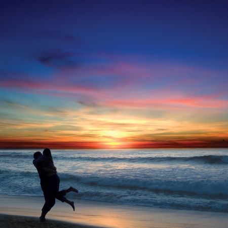 Honeymooners at Sunset along the Beach