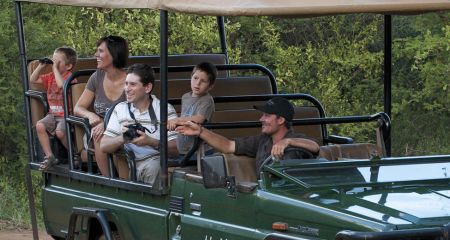 Young family on a safari game drive.